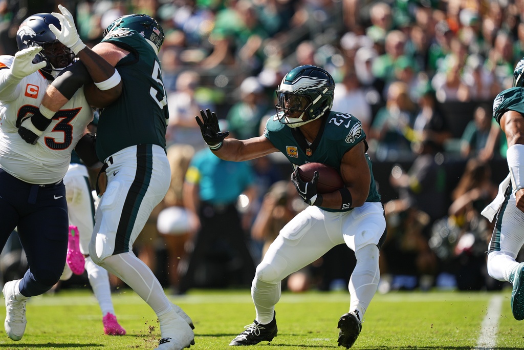 Philadelphia Eagles running back Saquon Barkley (26) carries the ball during the first half of an NFL football game against the Denver Broncos on Sunday, Oct. 5, 2025, in Philadelphia. (AP Photo/Matt Rourke)
