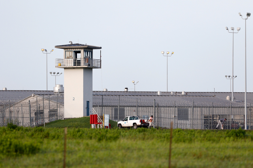 FILE - An inmate works outdoors during a hot summer day outside a Texas prison unit in Huntsville, Texas, on June 25, 2015. (Rose Baca/The Dallas Morning News via AP, File)