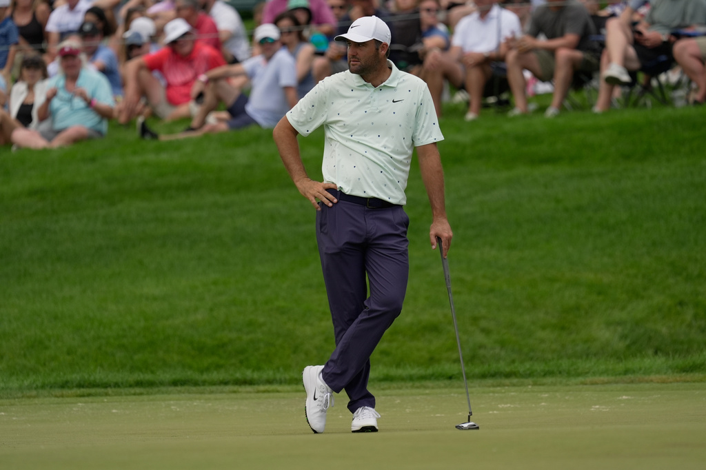 Scottie Scheffler pauses on the 14th green during the second round of the Memorial golf tournament in Dublin, Ohio, Friday, June 5, 2026. (AP Photo/Sue Ogrocki)