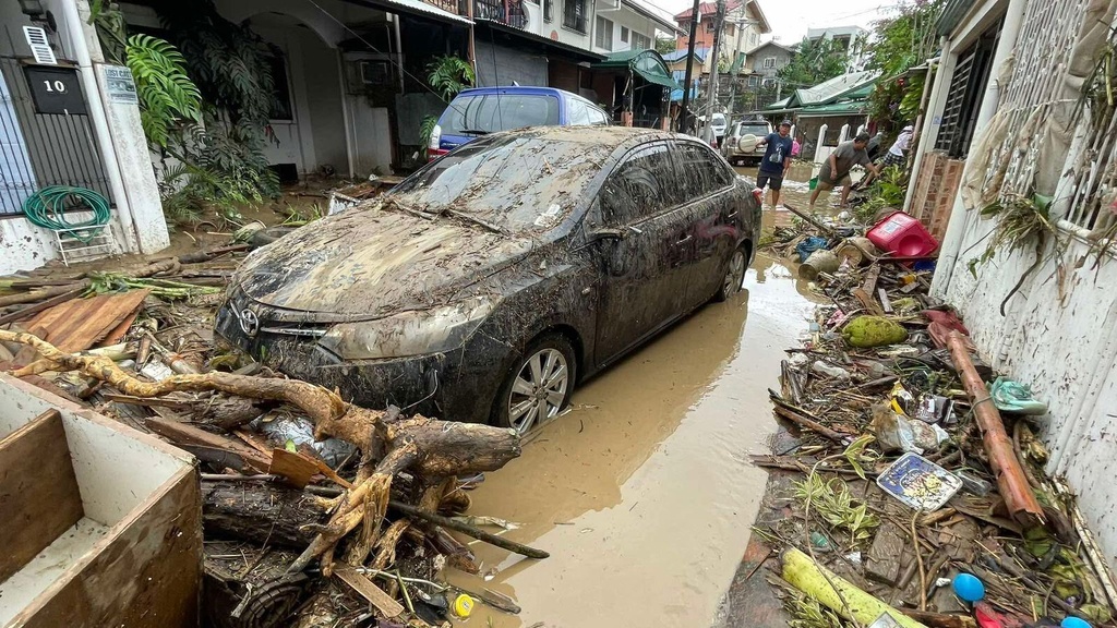 Damaged vehicles are seen after flooding caused by Typhoon Kalmaegi in Cebu city, central Philippines, Tuesday, Nov. 4, 2025. (AP Photo/Jacqueline Hernandez)