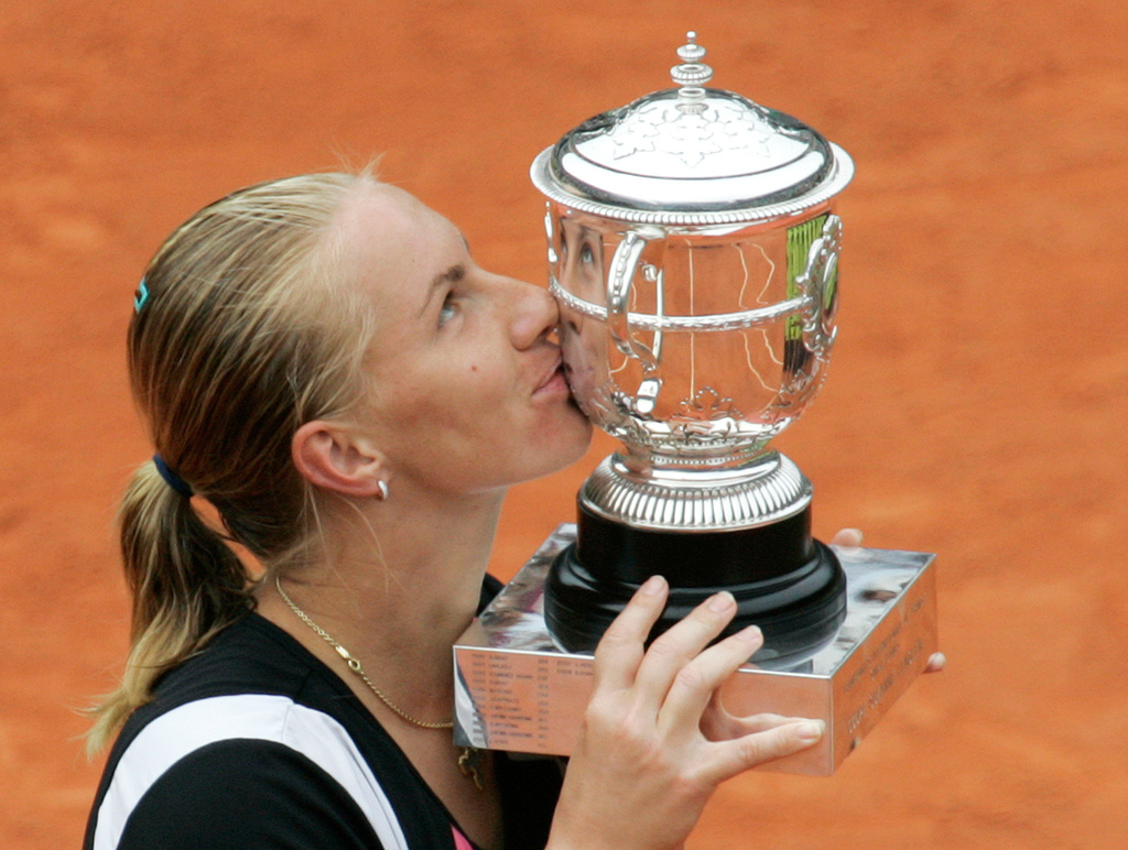 FILE - Russia's Svetlana Kuznetsova kisses the cup after defeating compatriot Dinara Safina after their women's singles final match of the French Open tennis tournament at the Roland Garros stadium in Paris, June 6, 2009. (AP Photo/Lionel Cironneau, file)