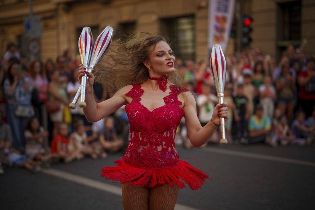 An artist of the Bucharest Metropolitan Circus perform during an event marking the day when the Romanian capital was first mentioned in historical records, 566 years ago, in Bucharest, Romania, Saturday, Sept. 20, 2025. (AP Photo/Vadim Ghirda)