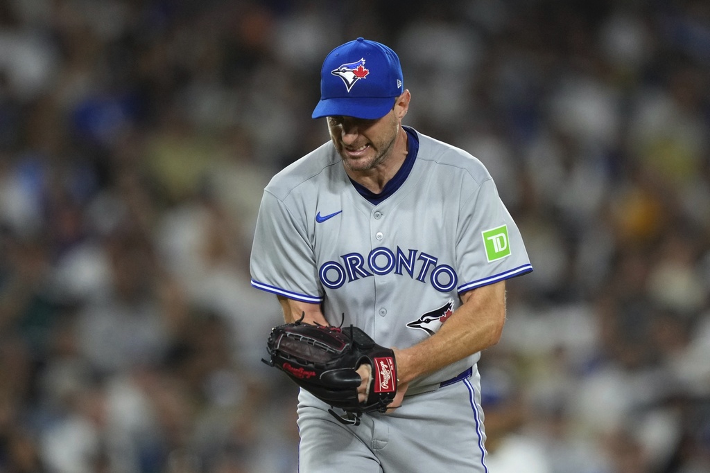 Toronto Blue Jays starting pitcher Max Scherzer celebrates after striking out Los Angeles Dodgers' Andy Pages to end the sixth inning of a baseball game Friday, Aug. 8, 2025, in Los Angeles. (AP Photo/Mark J. Terrill)