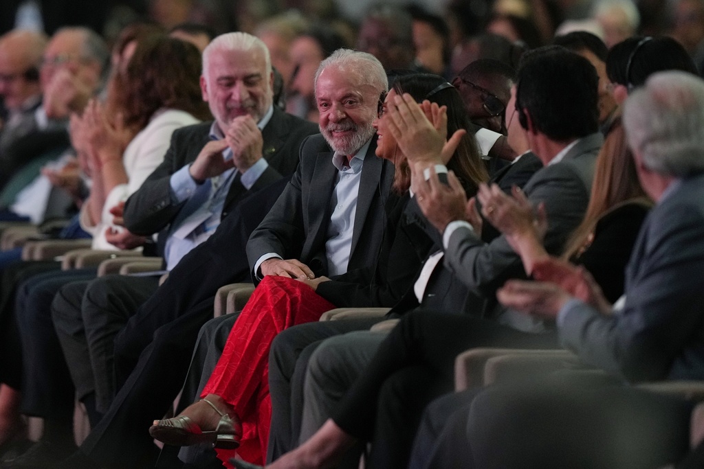 Brazil President Luiz Inacio Lula da Silva, center, reacts during a plenary session at the COP30 U.N. Climate Summit, Monday, Nov. 10, 2025, in Belem, Brazil. (AP Photo/Fernando Llano)
