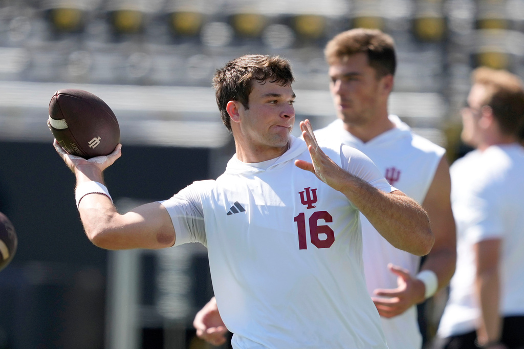 FILE - Indiana quarterback Alberto Mendoza warms up before an NCAA college football game against Iowa, Saturday, Sept. 27, 2025, in Iowa City, Iowa. (AP Photo/Charlie Neibergall, File)