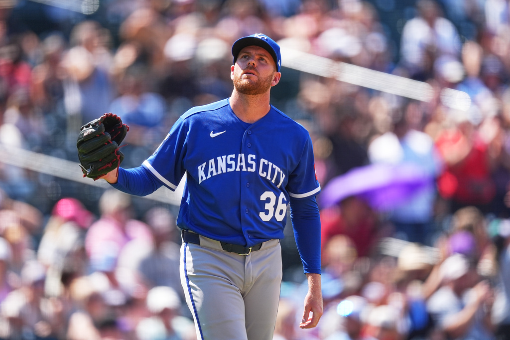 Kansas City Royals relief pitcher Aaron Bummer reacts after giving up a three-run home run to Colorado Rockies' Jake McCarthy in the sixth inning of a baseball game Sunday, Aug. 2, 2026, in Denver. (AP Photo/David Zalubowski)