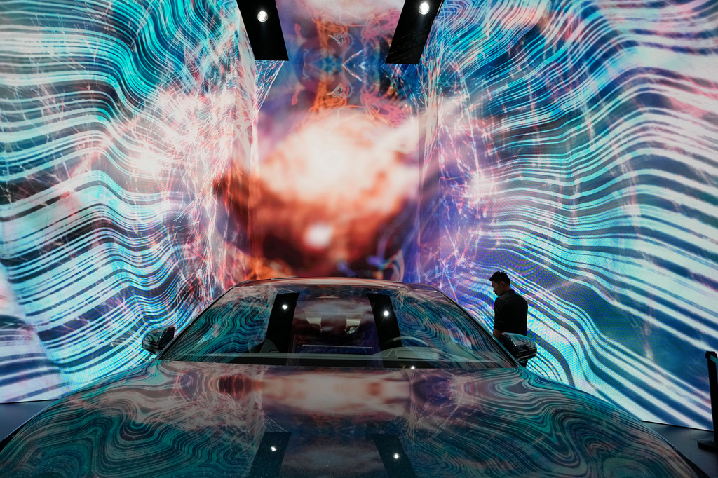 FILE - A man looks at the electric Han EV sedan from Chinese automaker BYD during the Auto Shanghai 2023 show in Shanghai, on April 19, 2023. (AP Photo/Ng Han Guan, File)