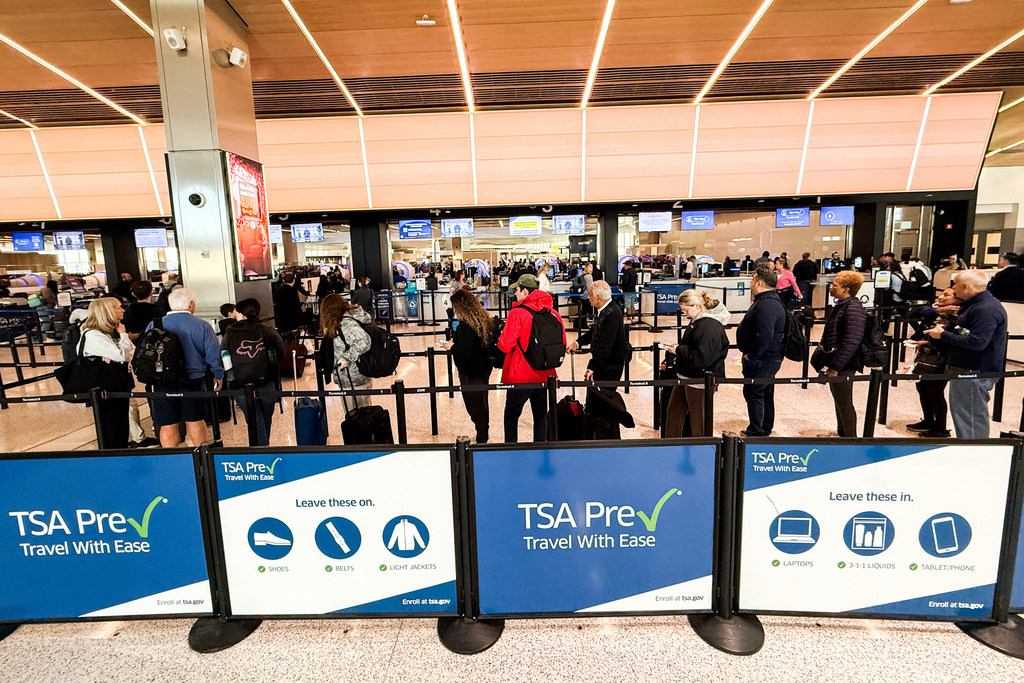 People wait in a TSA security line at Terminal A of Newark Liberty International Airport (EWR) in Newark, N.J., U.S., Tuesday, March 24, 2026. (AP Photo/Eduardo Munoz Alvarez)