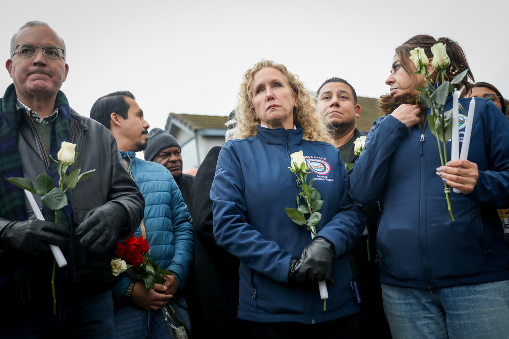 Stockton Mayor Christina Fugazi joins a vigil near the site at Thornton Blvd. and Lucile Ave., where a mass shooting took place Saturday at a banquet hall in Stockton, Calif., Sunday, Nov. 30, 2025. (Brontë Wittpenn/San Francisco Chronicle via AP)
