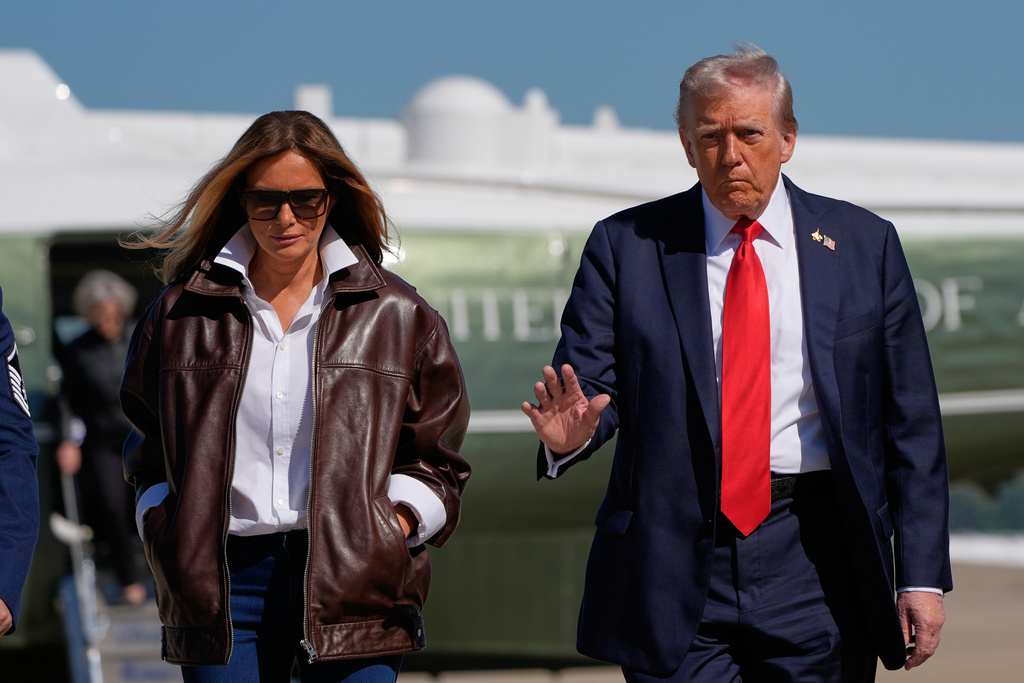 President Donald Trump and first lady Melania Trump walk from Marine One to board Air Force One, Sunday, Oct. 5, 2025, at Joint Base Andrews, Md., en route to Norfolk, Va. (AP Photo/Alex Brandon)