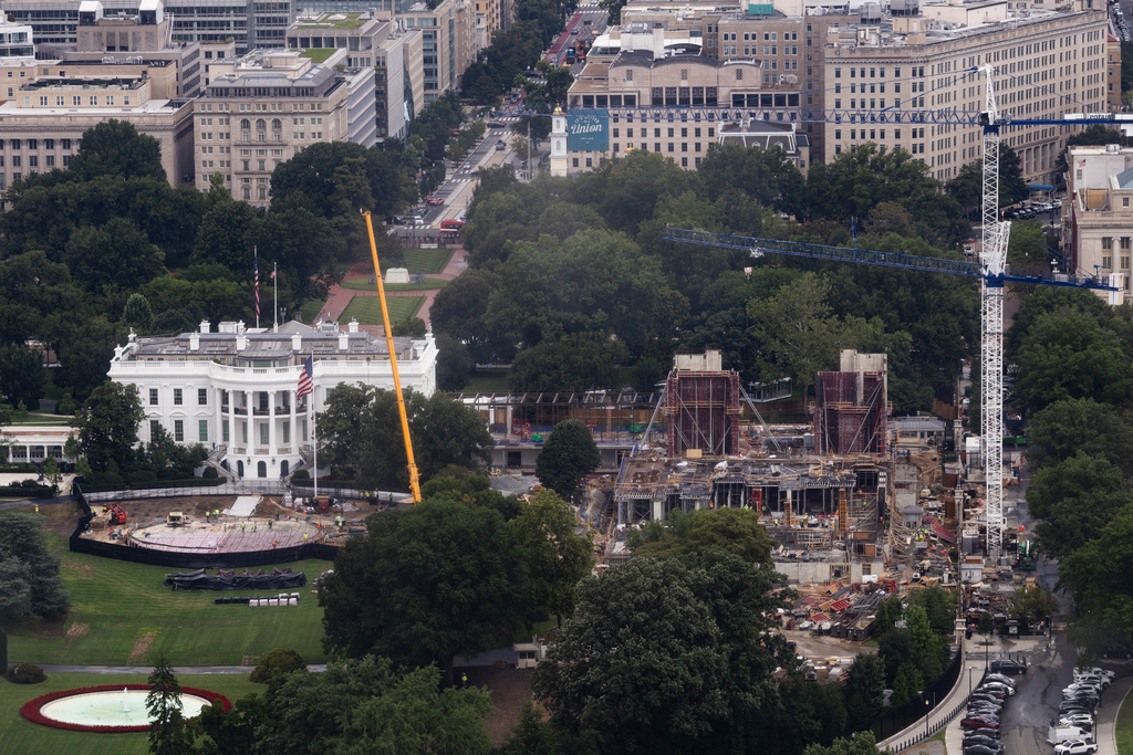 Construction continues on a helipad and the White House Ballroom on the South Lawn of the White House, Wednesday, Aug. 5, 2026, in Washington. (AP Photo/Tierney L. Cross)