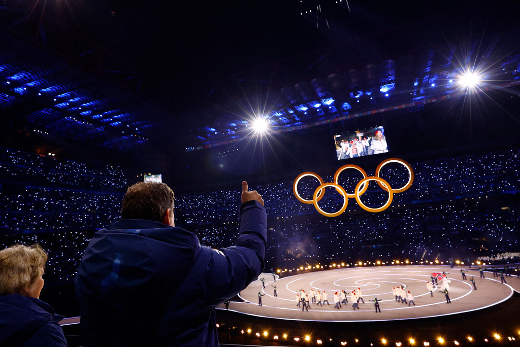 FILE - Kristin Kloster Aasen, former first vice president of Norwegian Olympic and Paralympic Committee, left, and Morten Aasen former Norwegian equestrian athlete wave to the Norway team at the Olympic opening ceremony at the 2026 Winter Olympics, in Milan, Italy, Friday, Feb. 6, 2026. (Susana Vera/Pool Photo via AP, ,File)