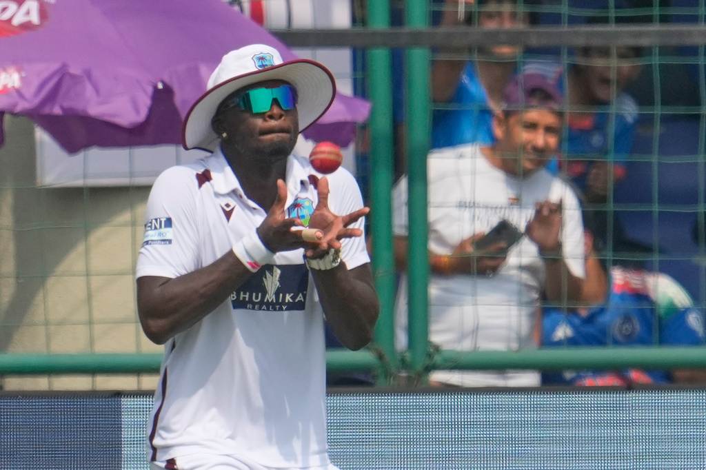 West Indies' Jayden Seales takes the catch of India's Nitish Kumar Reddy on the second day of the second cricket test match between India and West Indies at the Arun Jaitley Stadium in New Delhi, India, Saturday, Oct.11, 2025. (AP Photo/Manish Swarup)