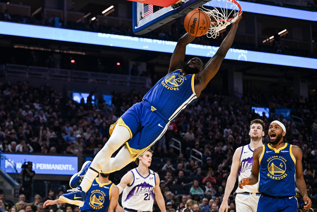 Golden State Warriors forward Draymond Green (23) dunks during the first half of an NBA basketball game against the Utah Jazz, Saturday, Jan. 3, 2026, in San Francisco. (AP Photo/Justine Willard)