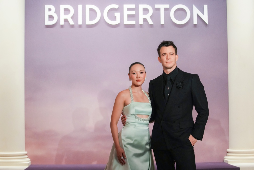Yerin Ha and Luke Thompson arrive for the World premiere of "Bridgerton" season 4 on Wednesday, Jan. 14, 2026 in Paris. (AP Photo/Christophe Ena)