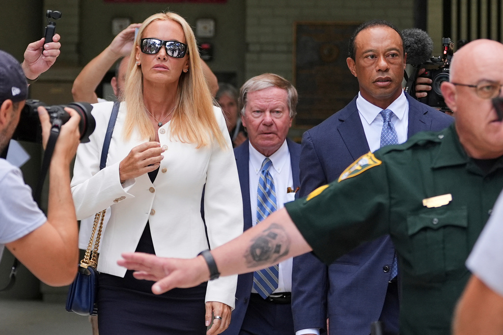 Golfer Tiger Woods, right, leaves with Vanessa Trump, left, after Woods' plea conference hearing in a DUI case stemming from a rollover crash in Florida in March, Wednesday, Sept. 2, 2026, in Stuart, Fla. (AP Photo/Rebecca Blackwell)