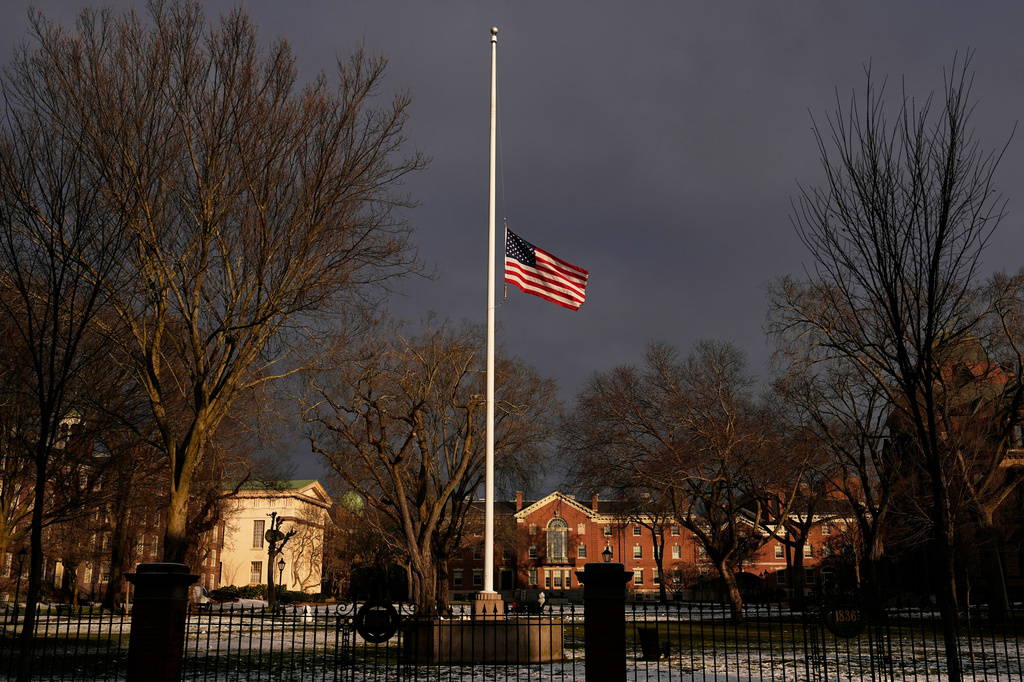 FILE - The U.S. flag flies at half-staff on the Main Green in honor of the victims of the campus shooting at Brown University, Dec. 17, 2025, in Providence, R.I. (AP Photo/Robert F. Bukaty, File)