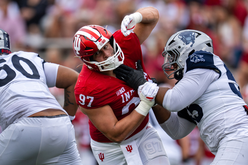 Indiana defensive lineman Mario Landino (97) battles Howard offensive lineman Guan Price II (55) during the second half an NCAA college football game, Saturday, Sept. 12, 2026, in Bloomington, Ind. (AP Photo/Doug McSchooler)