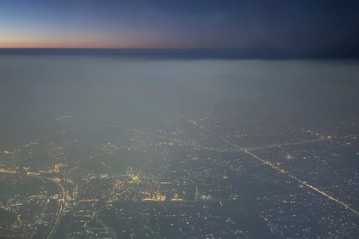 A layer of smog hangs over the skyline as seen from an aircraft window in New Delhi, India, Saturday, Oct. 25, 2025. (AP Photo/Yirmiyan Arthur) A layer of smog hangs over the skyline as seen from an aircraft window in New Delhi, India, Saturday, Oct. 25, 2025. (AP Photo/Yirmiyan Arthur)