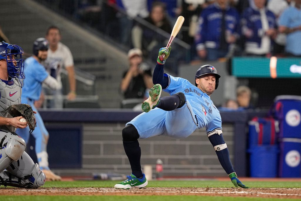 Toronto Blue Jays' George Springer gets out of the way of a pitch against the Los Angeles Dodgers during the eighth inning in Game 6 of baseball's World Series, Friday, Oct. 31, 2025, in Toronto. (AP Photo/Brynn Anderson)