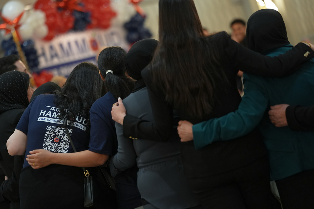 People pose for a photo during the launch of Mohamed Ali Hammoud's campaign for Dearborn Public Schools Board of Education member, Wednesday, April 8, 2026, in Dearborn, Mich. (AP Photo/Julia Demaree Nikhinson)