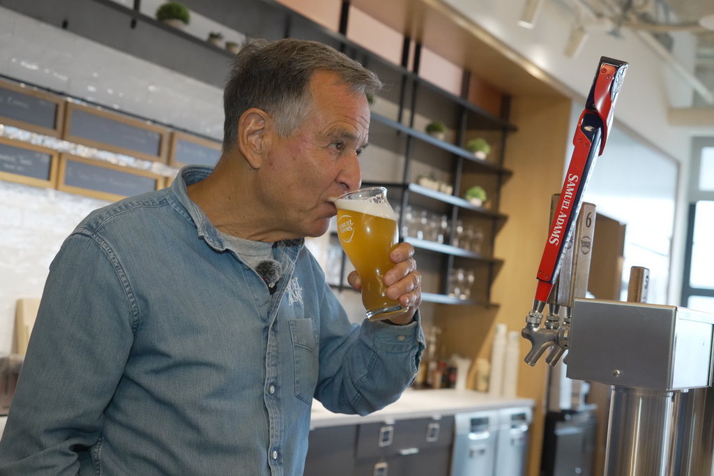Boston Beer Co. Founder and CEO Jim Koch sips beer at his company headquarters in Boston, Tuesday, July 7, 2026. (AP Photo/Rodrique Ngowi)