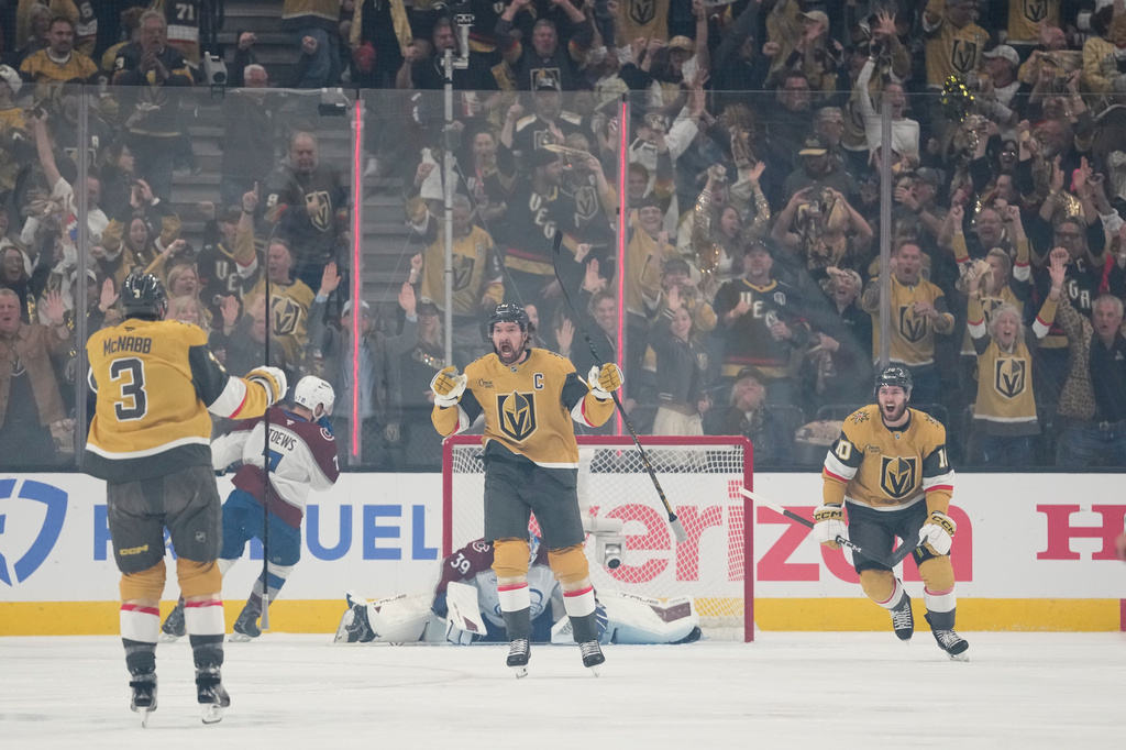 Vegas Golden Knights right wing Mark Stone, middle, celebrates after scoring a goal during the first period in Game 4 of the Western Conference finals NHL hockey Stanley Cup playoff series against the Colorado Avalanche Tuesday, May 26, 2026, in Las Vegas. (AP Photo/John Locher)