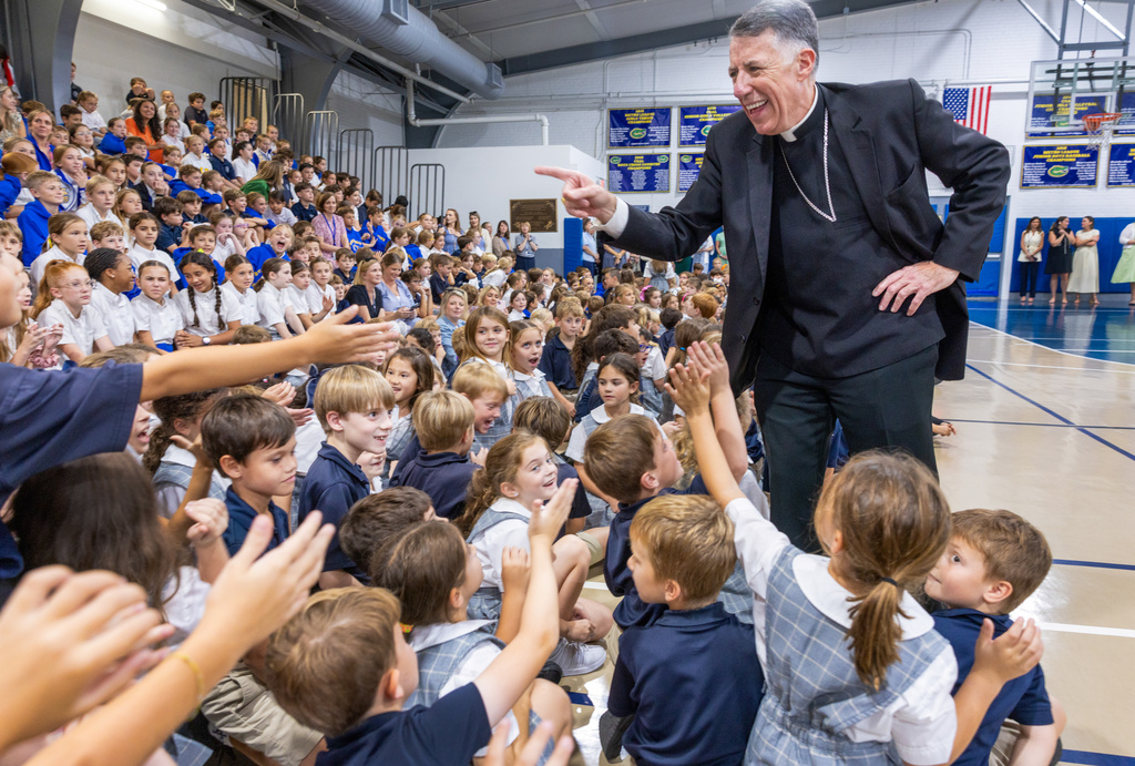 Most Rev. Fr. James F. Checchio meets students at St. Catherine of Siena in Metairie during his introduction as the next Archbishop of New Orleans on Wednesday, Sept. 24, 2025, in New Orleans. (Chris Granger/The Times-Picayune/The New Orleans Advocate via AP)