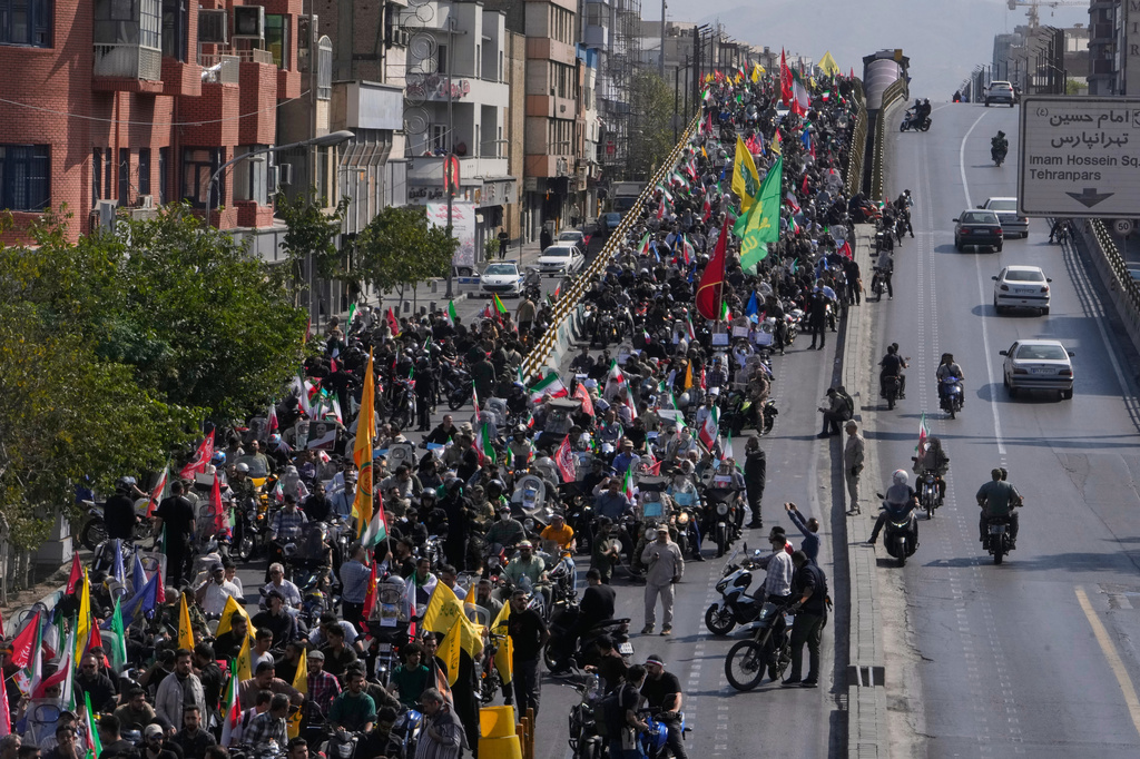 Motorcyclists ride during a state-organized motorcycle parade called "Janfada," meaning "Sacrifice for Iran,", in Tehran, Iran, Friday, Sept. 25, 2026. (AP Photo/Vahid Salemi)