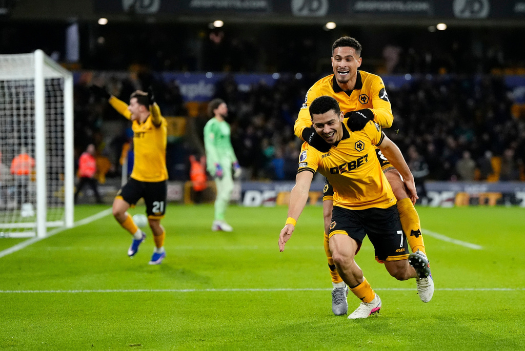 Wolverhampton Wanderers' Andre, front right, celebrates after scoring their second goal of the game during an English Premier League match against Liverpool, Tuesday, March 3, 2026, in Wolverhampton, England. (Nick Potts/PA via AP)