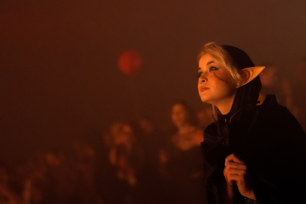 A woman donning fantasy ears attends a Halloween rave in Kyiv, Ukraine, Saturday, Oct. 25, 2025. (AP Photo/Julia Demaree Nikhinson)