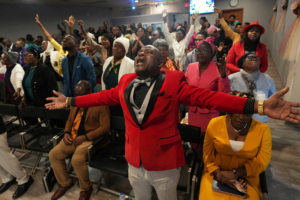 FILE - Jean-Michel Gisnel cries out while praying with other congregants at the First Haitian Evangelical Church of Springfield, Jan. 26, 2025, in Springfield, Ohio. (AP Photo/Luis Andres Henao, file)