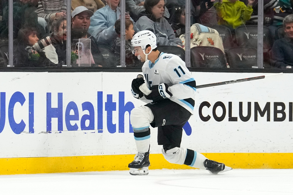 Utah Mammoth right wing Dylan Guenther celebrates a goal during the first period of an NHL hockey game against the Anaheim Ducks, Wednesday, Dec. 3, 2025, in Anaheim, Calif. (AP Photo/Mark J. Terrill)