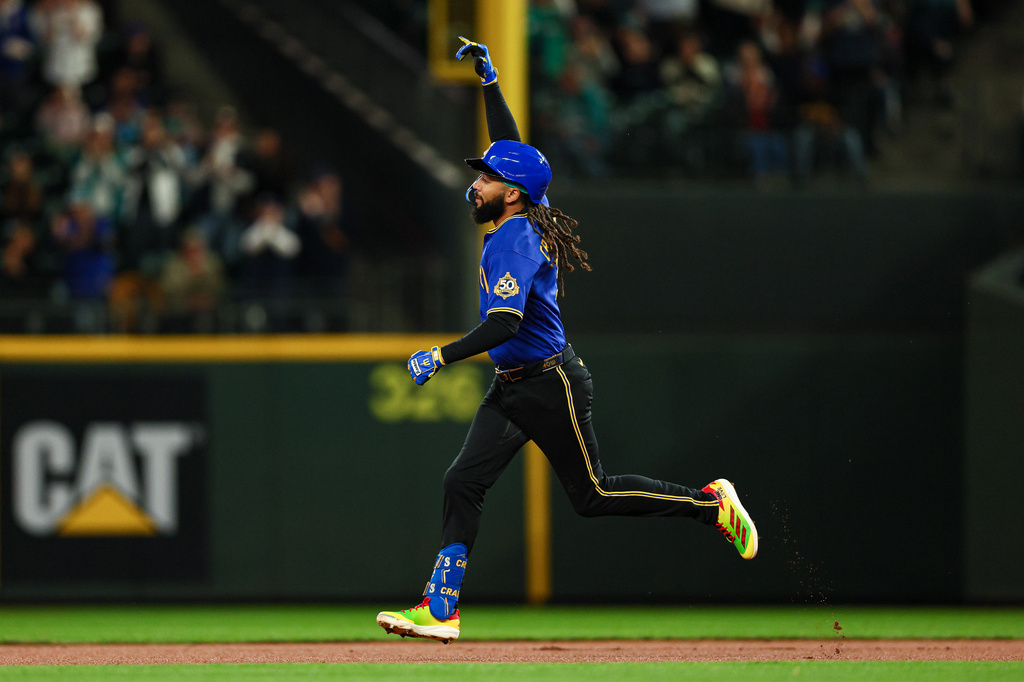 Seattle Mariners' J.P. Crawford gestures as he rounds the bases after hitting a one-run home run against the Arizona Diamondbacks during the first inning of a baseball game Friday, May 29, 2026, in Seattle. (AP Photo/Caean Couto)