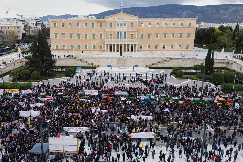 Farmers drive their tractors in front of the Greek parliament as they protesting against high production costs, low prices for their products and delays in subsidy payments, in central Athens, on Friday, Feb. 13, 2026. (AP Photo/Petros Giannakouris)