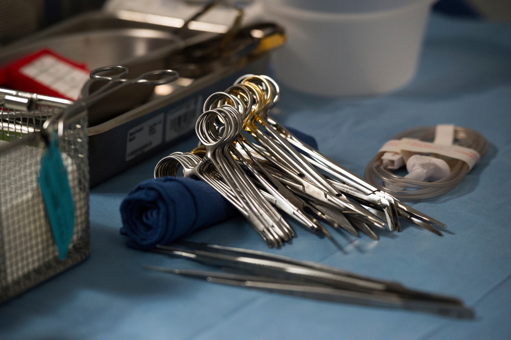 FILE - Surgical instruments and supplies lay on a table during a kidney transplant surgery at MedStar Georgetown University Hospital in Washington D.C., June 28, 2016. (AP Photo/Molly Riley, File)