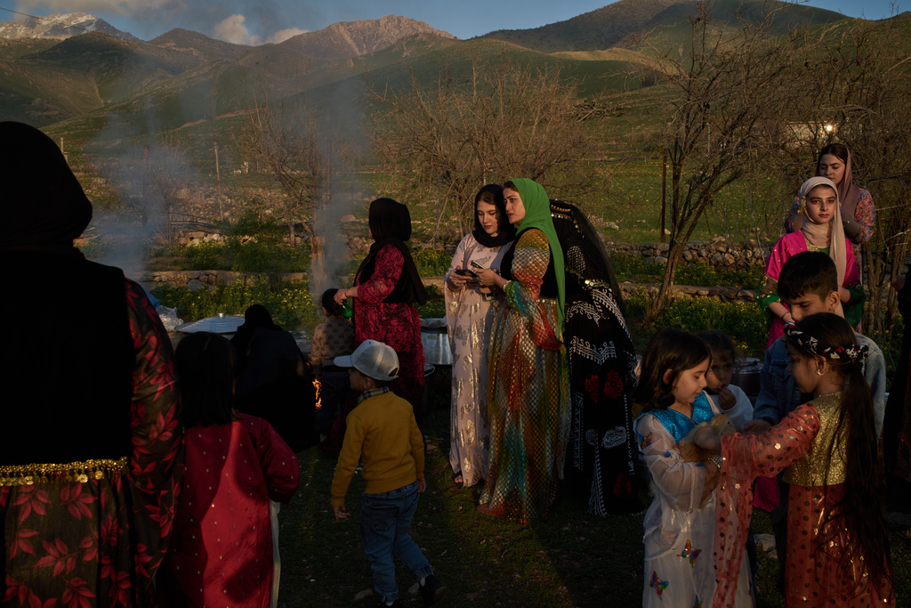 Women take part in a family gathering to break the fast with an Iftar meal during the Muslim holy month of Ramadan in the village of Gulp, Iraq, Tuesday, March 17, 2026. (AP Photo/Leo Correa)