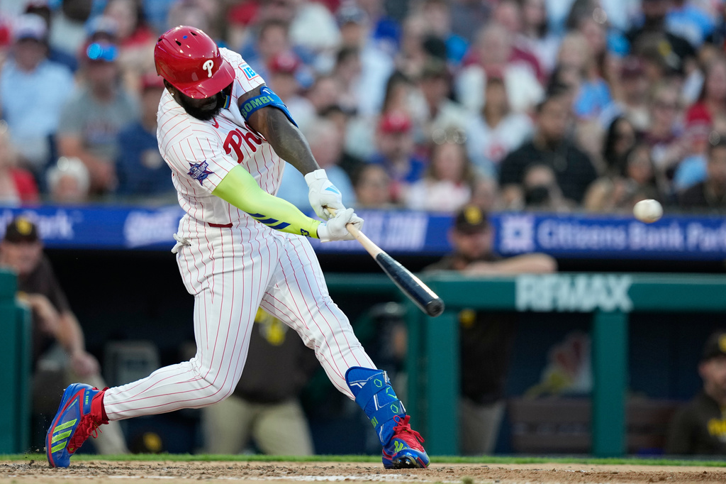 Philadelphia Phillies' Adolis García hits a run-scoring double against San Diego Padres pitcher Walker Buehler during the fifth inning of a baseball game Wednesday, June 3, 2026, in Philadelphia. (AP Photo/Matt Slocum)