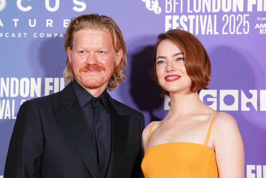 Jesse Plemons, left, and Emma Stone pose for photographers upon arrival at the premiere of the film "Bugonia" during the London film festival in London, Friday, Oct. 10, 2025. (Photo by Scott A Garfitt/Invision/AP)