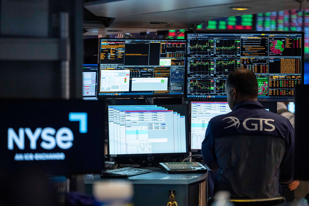 Specialists Dilip Patel works on the floor of the New York Stock Exchange, Thursday, Aug. 27, 2026, in New York. (AP Photo/Yuki Iwamura)