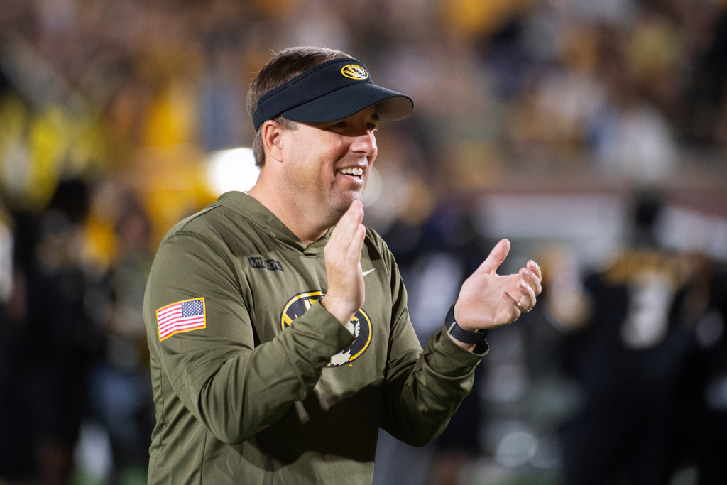 Missouri head coach Eli Drinkwitz claps during the first half of an NCAA college football game against Mississippi State, Saturday, Nov. 15, 2025, in Columbia, Mo. (AP Photo/L.G. Patterson)