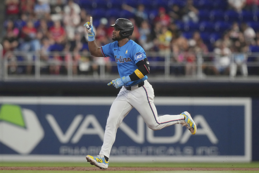 Miami Marlins' Otto Lopez gestures after hitting a three-run home run during the first inning of a baseball game against the Philadelphia Phillies Sunday, Sept. 7, 2025, in Miami. (AP Photo/Marta Lavandier)