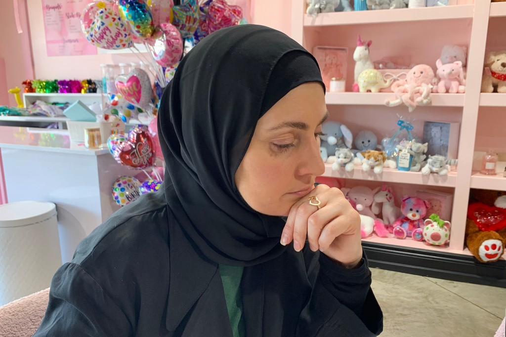 Maya Attoui discusses plans for a fundraiser while seated at a coffee shop on May 29, 2026, in Dearborn, Mich. (AP Photo/Mike Householder)