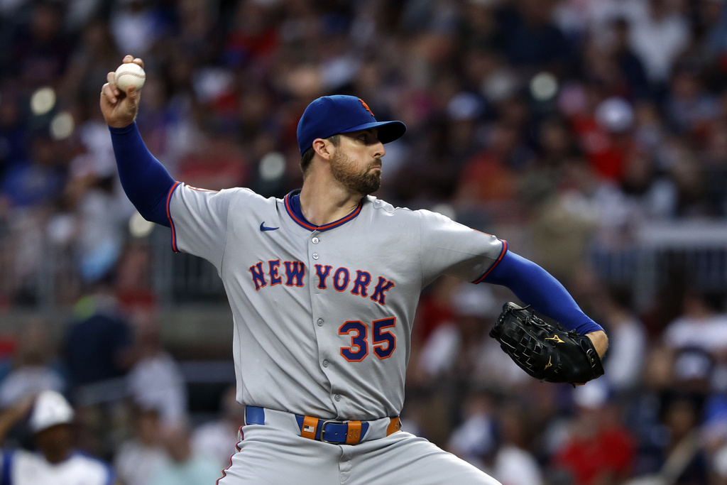 New York Mets pitcher Clay Holmes throws during the first inning of a baseball game against the Atlanta Braves, Saturday, Aug. 23, 2025, in Atlanta. (AP Photo/Butch Dill)
