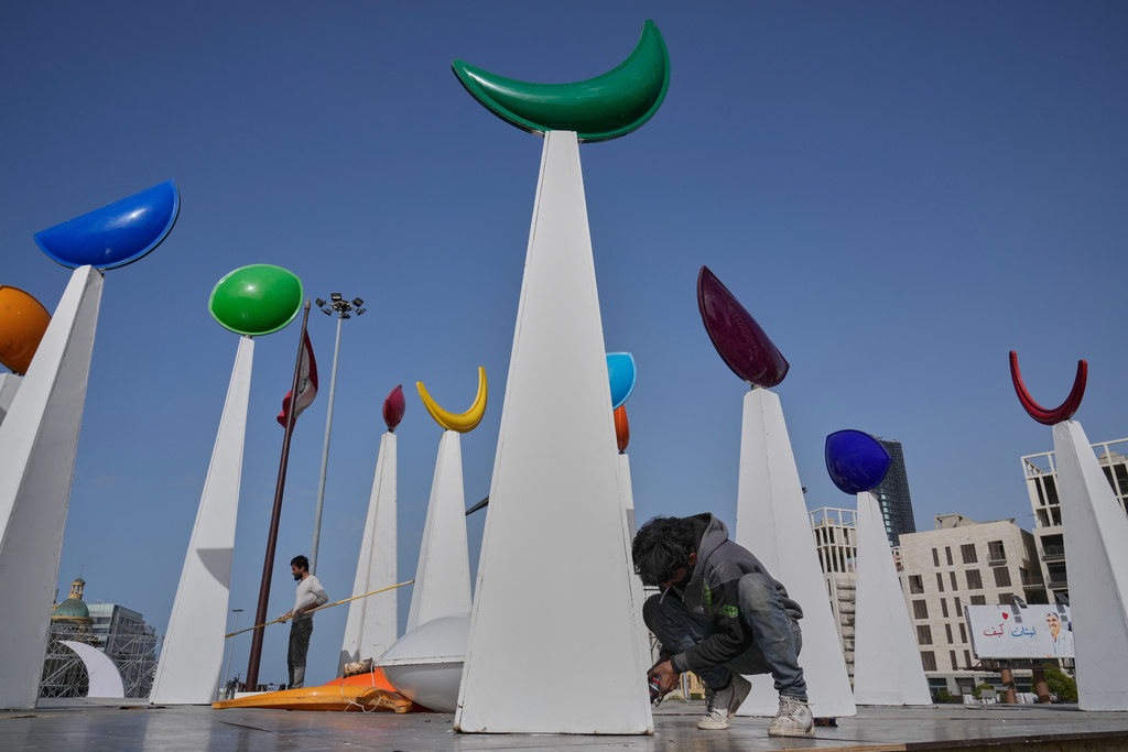 A worker sets decorations in preparation for the upcoming Muslim holy month of Ramadan, in downtown Beirut, Lebanon, Tuesday, Feb. 17, 2026. (AP Photo/Hussein Malla)
