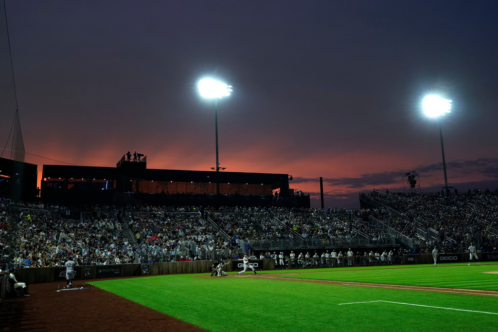FILE - The New York Yankees play the Chicago White Sox during a baseball game in Dyersville, Iowa, Aug. 12, 2021.(AP Photo/Charlie Neibergall, File)