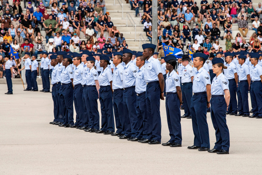 FILE - The front row of 14 graduates, part of a group who graduated from basic training and were sworn in as new citizens under a government initiative, graduate from Basic Military Training on April 26, 2023, at Joint Base San Antonio-Lackland, Texas. (Christa D'Andrea/U.S. Air Force via AP)