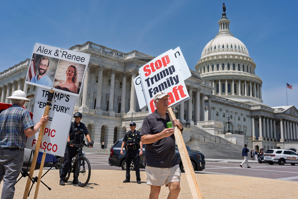 Activists endure high temperatures to protest against corruption and President Donald Trump at the Capitol in Washington, Tuesday, June 30, 2026. (AP Photo/J. Scott Applewhite)