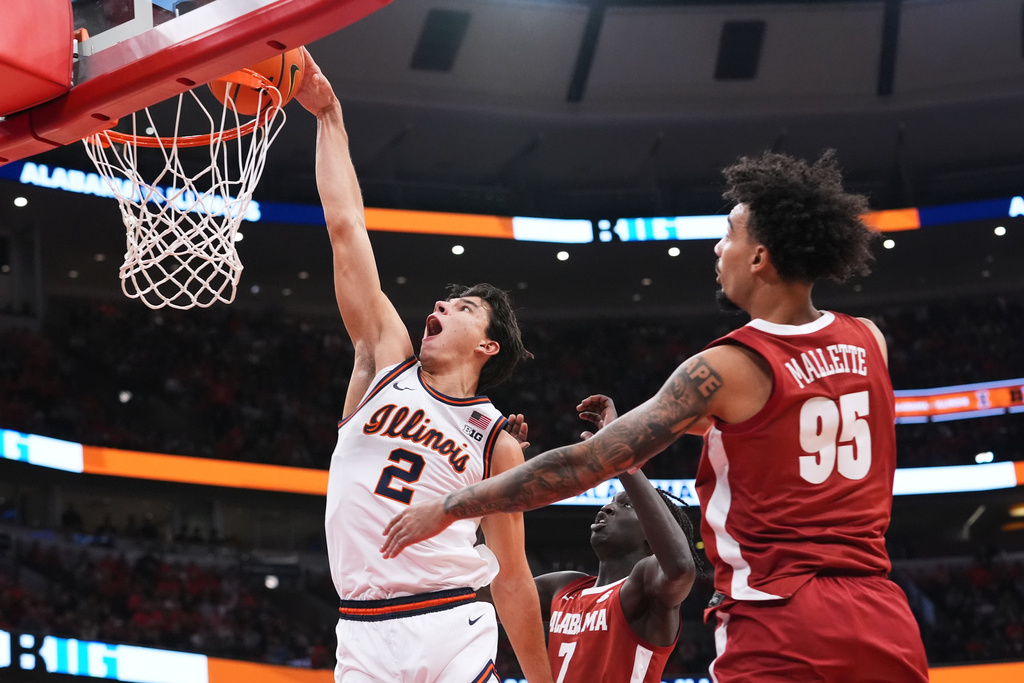 Illinois guard Andrej Stojakovic (2) dunks against Alabama during the first half of an NCAA college basketball game in Chicago, Wednesday, Nov. 19, 2025. (AP Photo/Nam Y. Huh)