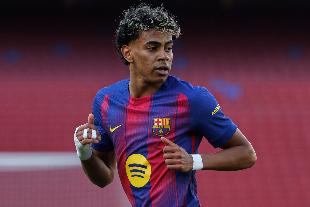 Barcelona's Lamine Yamal runs during a La Liga soccer match between Barcelona and Levante in Barcelona, Spain, Sunday, Feb. 22, 2026. (AP Photo/Joan Monfort)